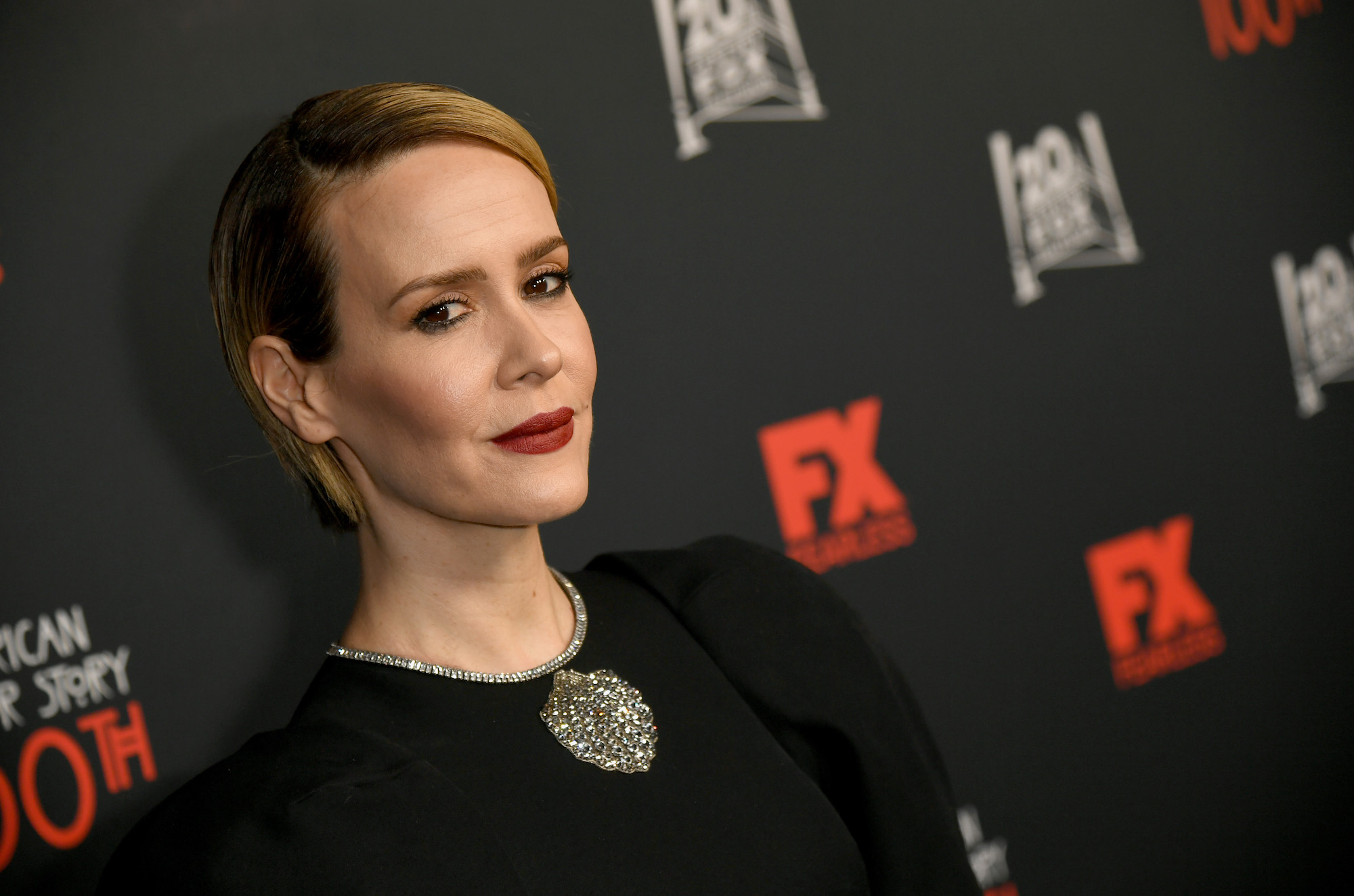 Sarah Paulson, a star in 'American Horror Story' Season 10, against a black background at FX's 'American Horror Story' 100th Episode Celebration