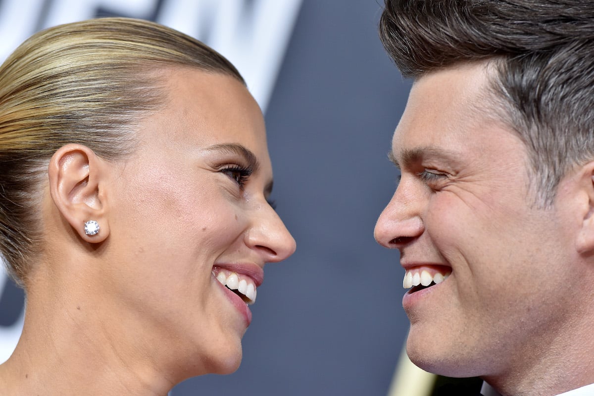 Scarlett Johansson and Colin Jost looking at each other