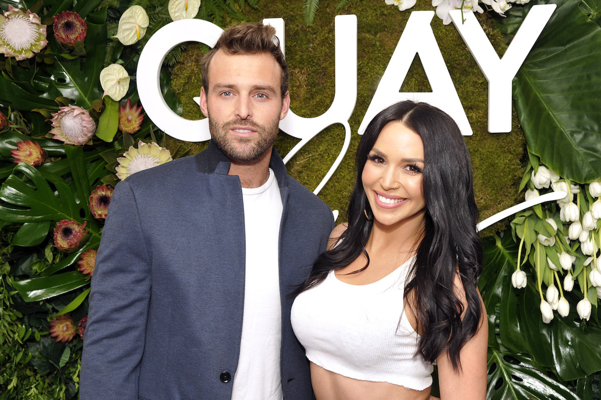 Robby Hayes and Scheana Shay pose together, facing the camera and smiling.