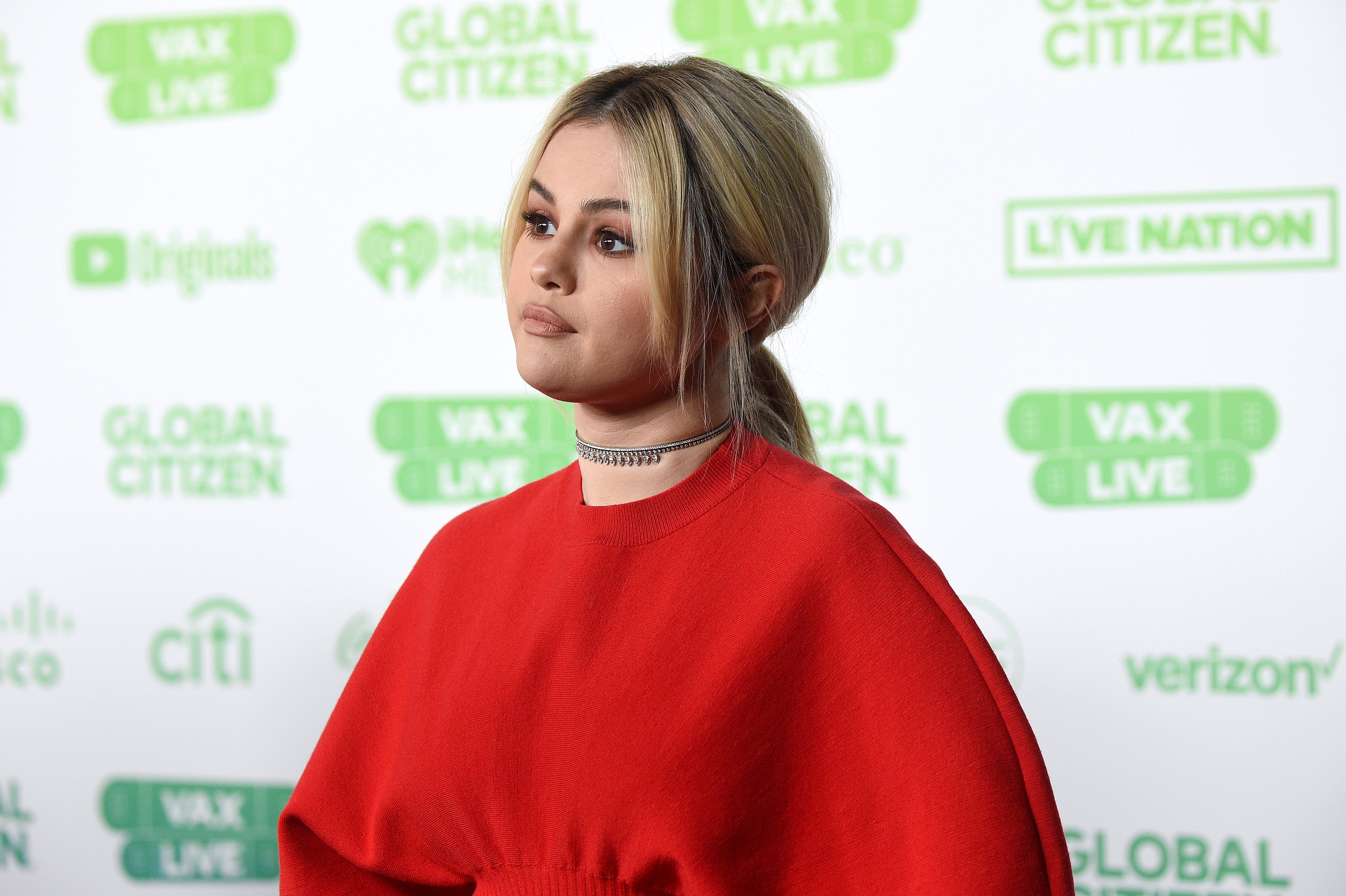 Selena Gomez speaking onstage during Global Citizen VAX LIVE