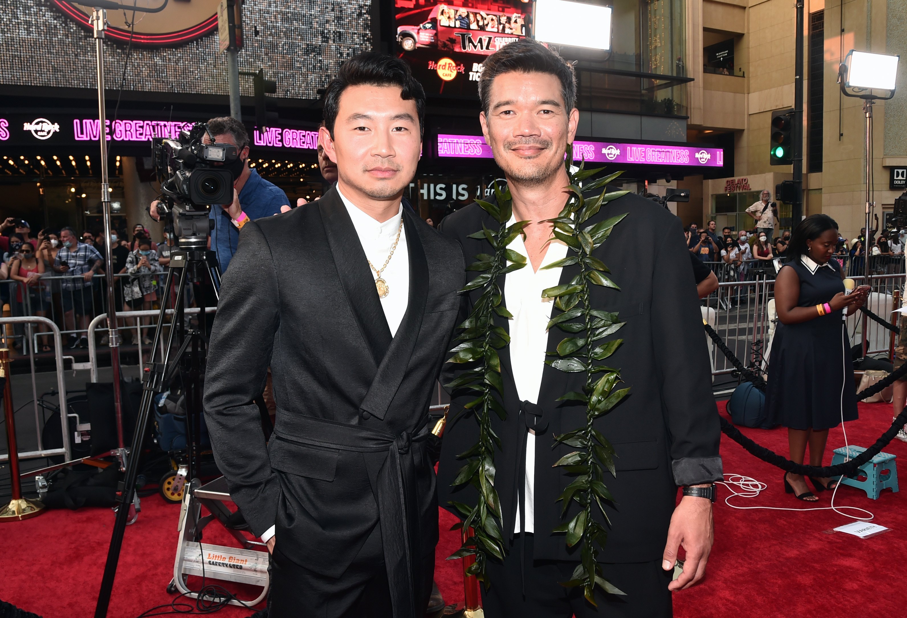 Simu Liu and Director Destin Daniel Cretton attend the 'Shang-Chi and the Legend of the Ten Rings' wearing black suit with white dress shirt