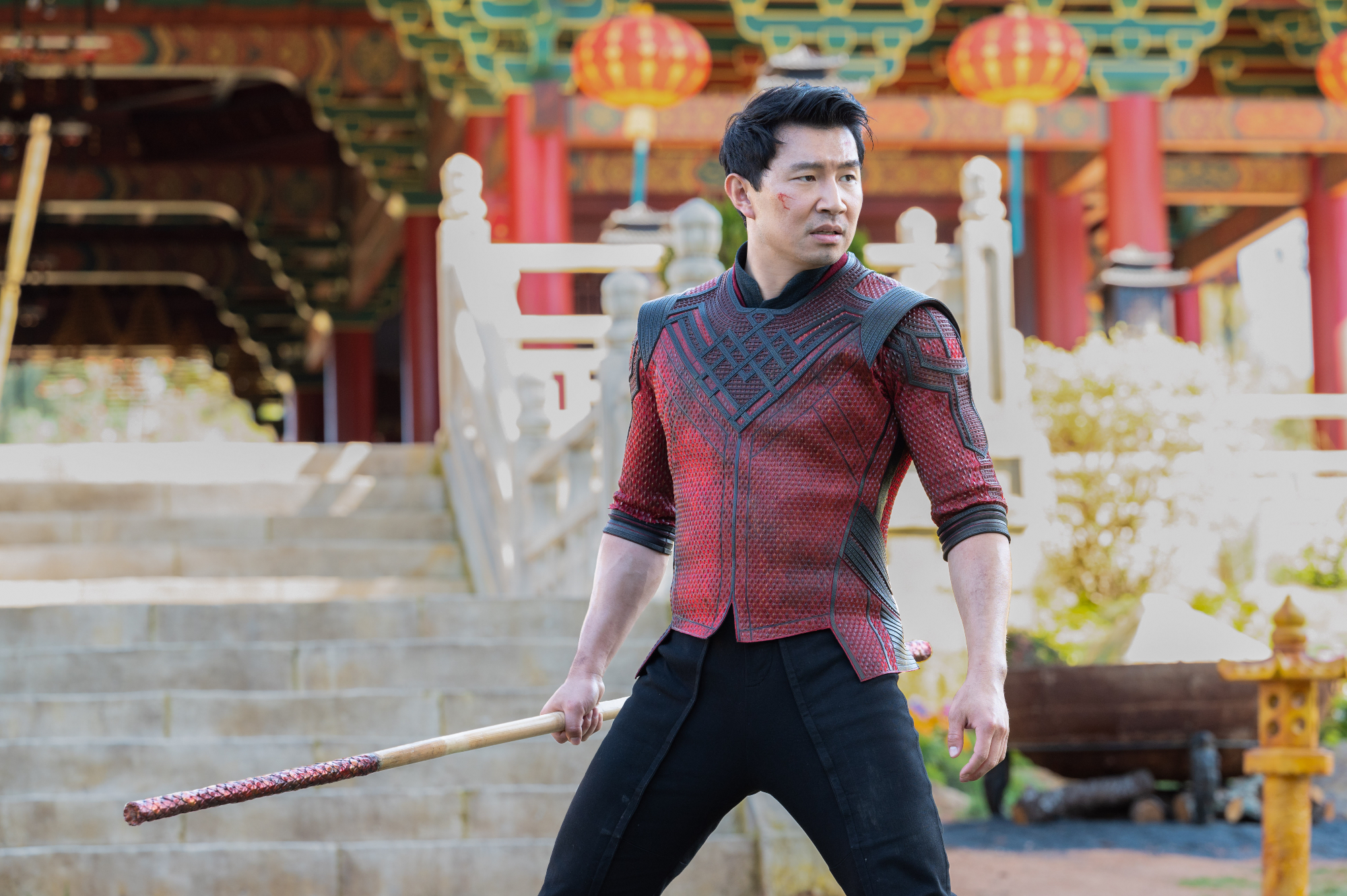 Simu Liu fighting with staff as Shang-Chi in 'Shang-Chi and the Legend of the Ten Rings'