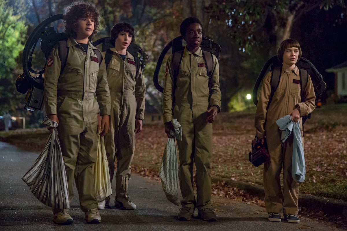 (L-R) Gaten Matarazzo, Finn Wolfhard, Caleb McLaughlin, and Noah Schnapp dressed like the Ghostbusters in 'Stranger Things' Season 2.