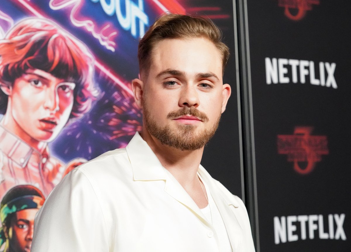 'Stranger Things' Dacre Montomgery in a white tshirt and jacket at the premiere of season 3.