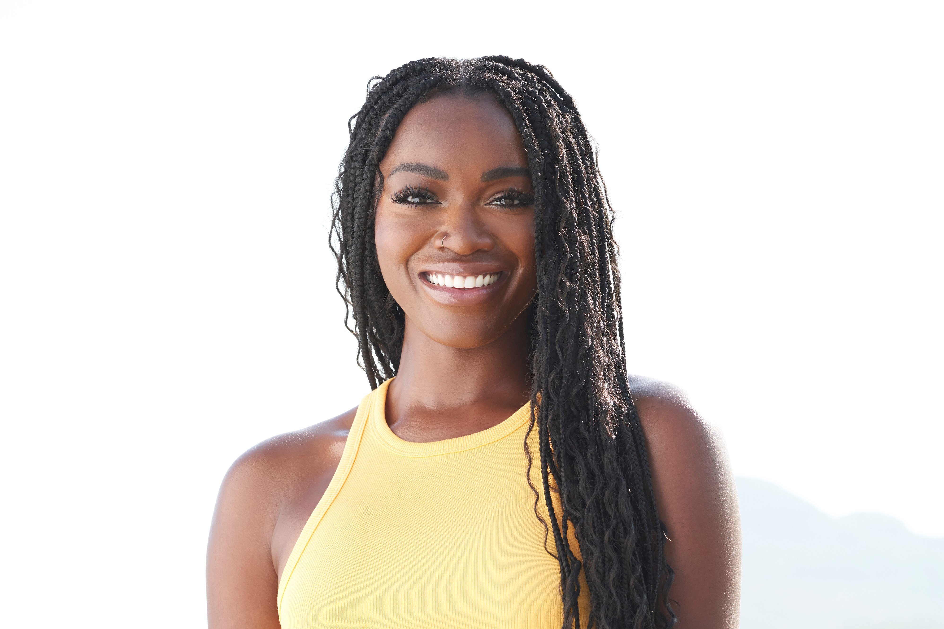 Tahzjuan Hawkins in a yellow tank top on 'Bachelor in Paradise.'