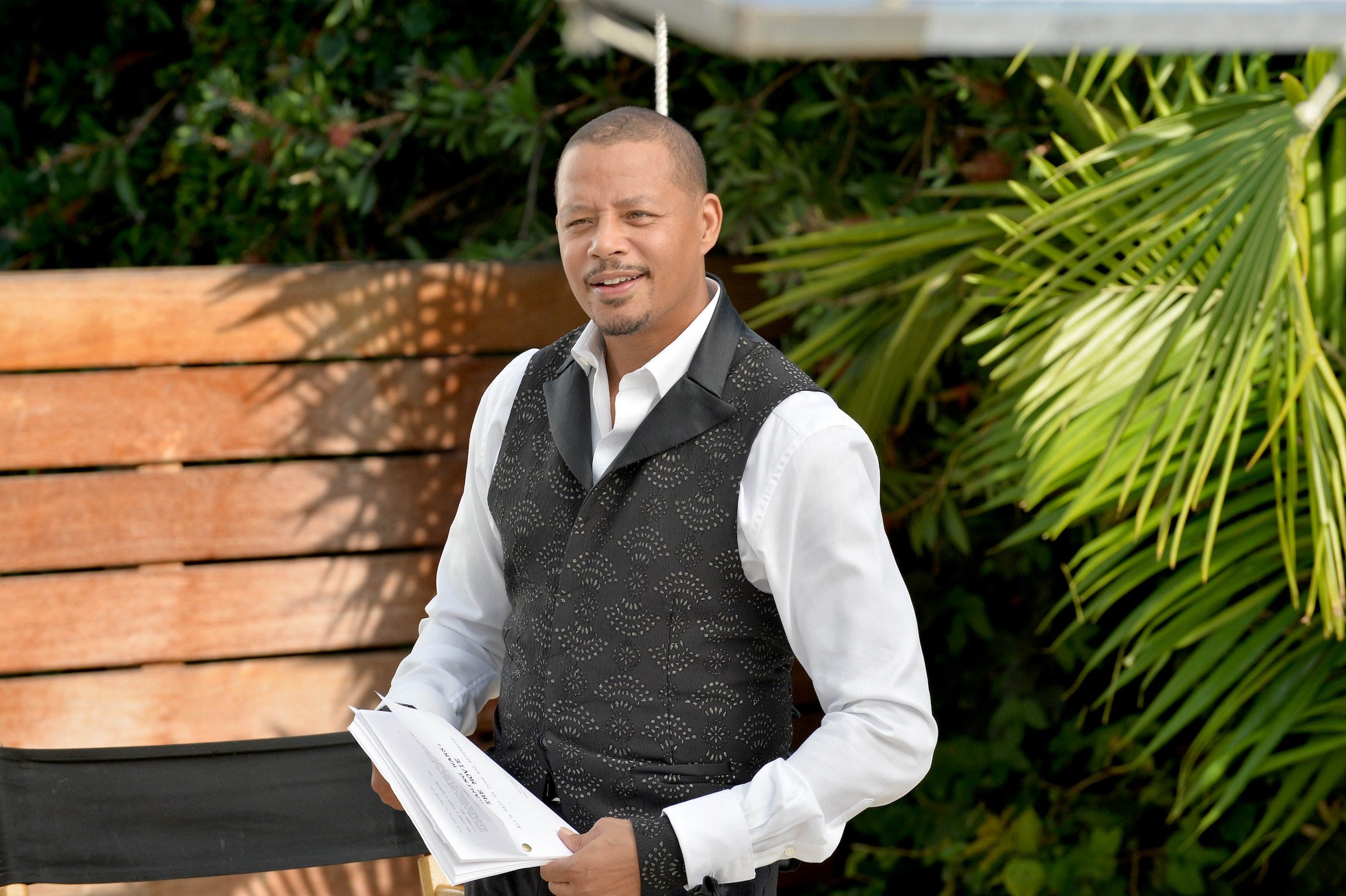 Terrence Howard holding a script on set