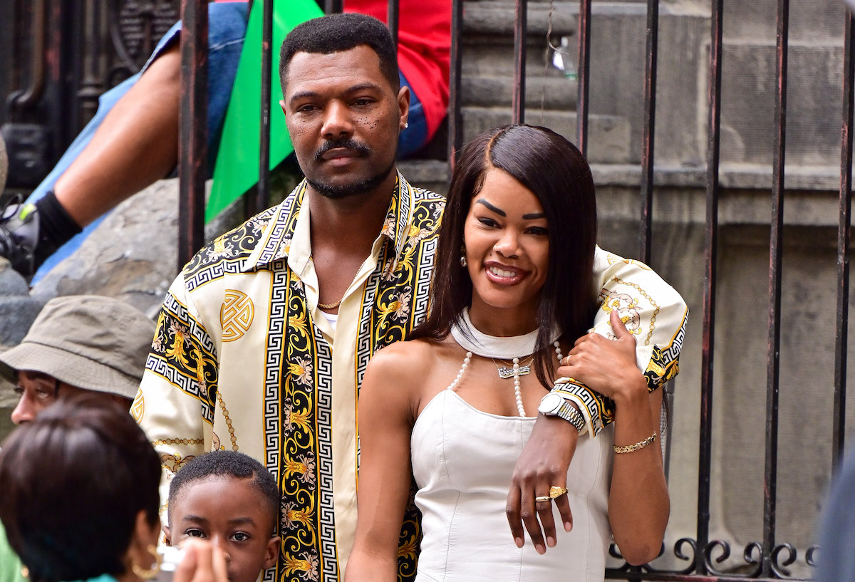 Teyana Taylor (R) in a cream dress, seen on the set of "A Thousand and One" in Harlem on August 09, 2021 in New York City.