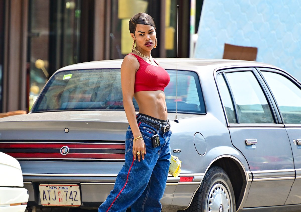 Teyana Taylor in a red crop top and jean bottoms, seen on the set of 'A Thousand and One' in Harlem on July 27, 2021 in New York City.
