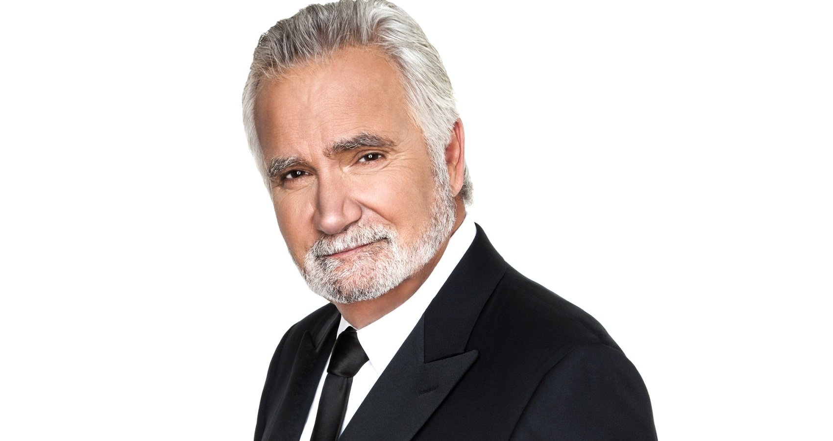 The Bold and the Beautiful stars John McCook as Eric Forrester, pictured here in a publicity shot in a tuxedo against a white background