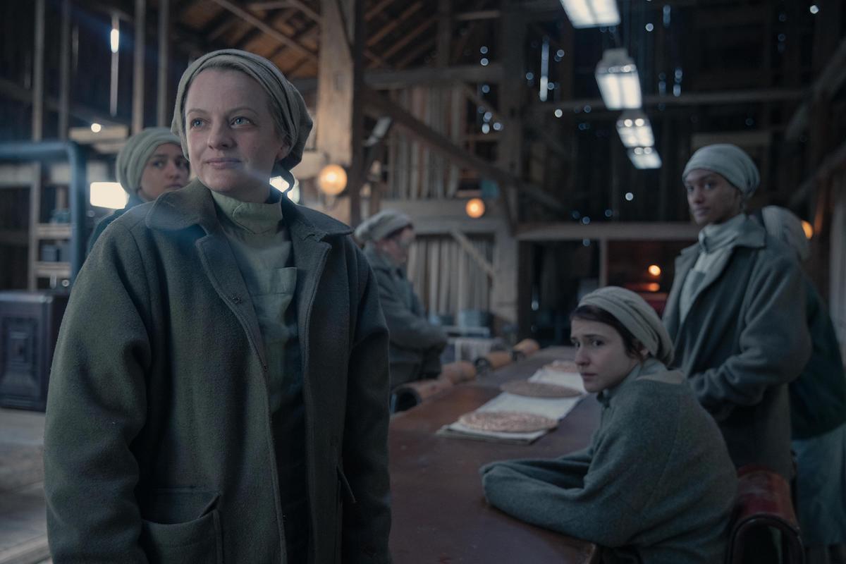 Elisabeth Moss and 'The Handmaid's Tale' Season 4 Episode 2 cast. Moss and the other women wear pale green Martha uniforms and gather in a large barn at a table. 'The Handmaid's Tale' Season 4 Episode 2, 'Nightshade,' marked a huge change in series.