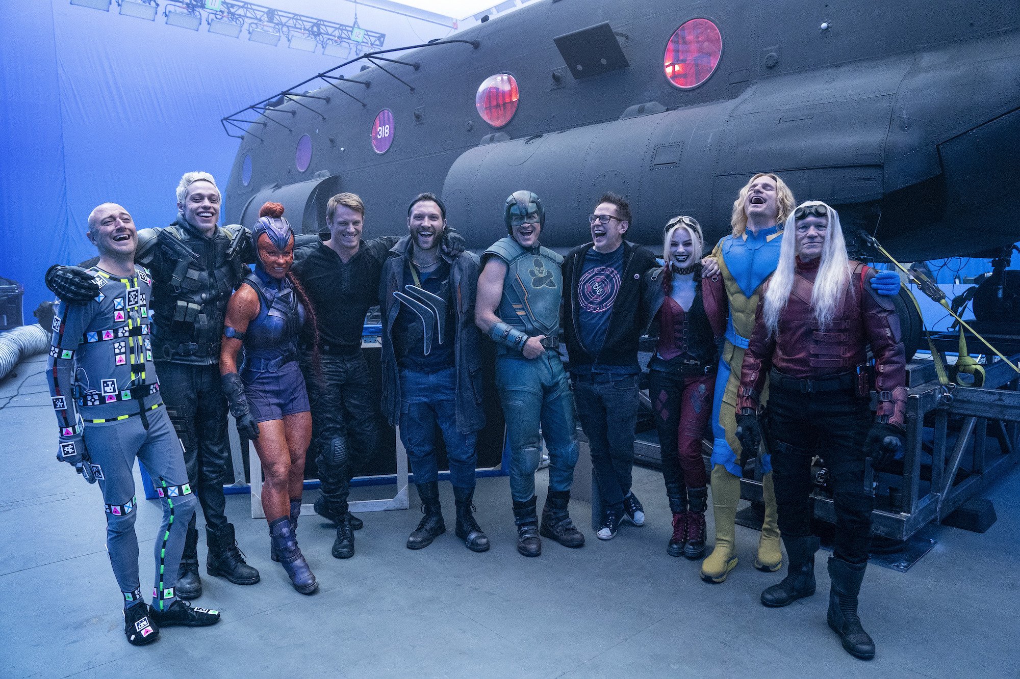 The Suicide Squad cast stands arm in arm with James Gunn