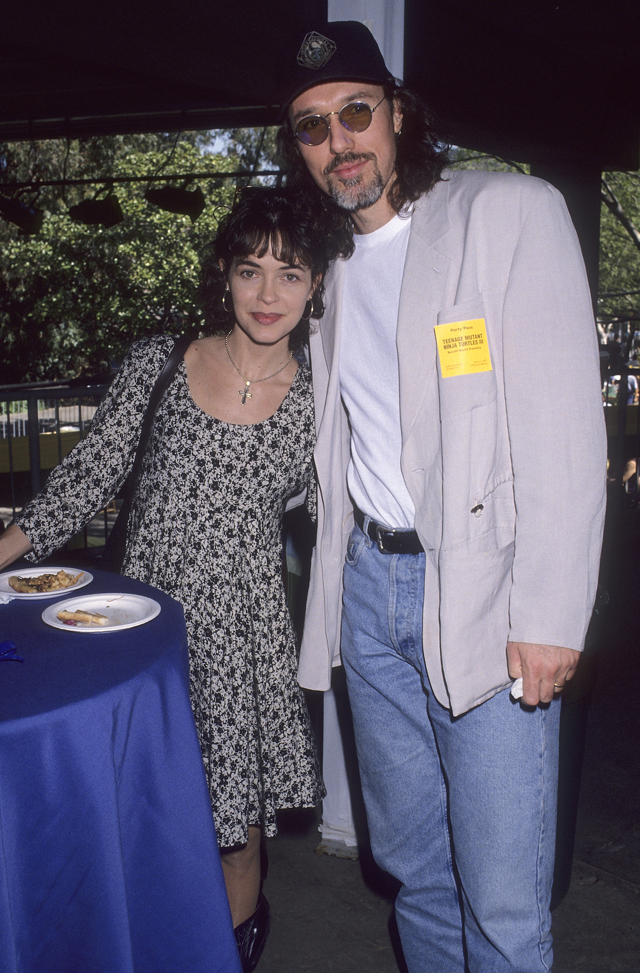 Thomas Ian Griffith and Mary Page Keller stand beside a table