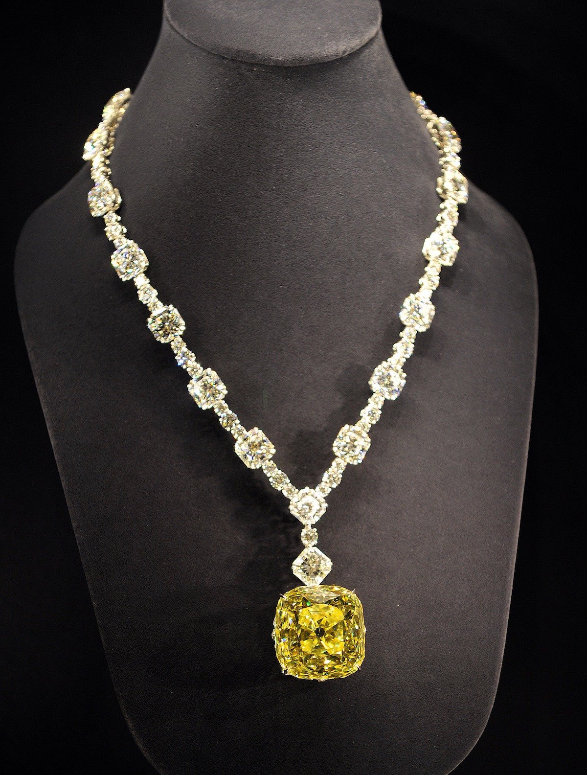 US luxury jeweler Tiffany displays a diamond necklace with a 128.54ct yellow diamond at a reception to celebrate Tiffany's 175th anniversary in Tokyo