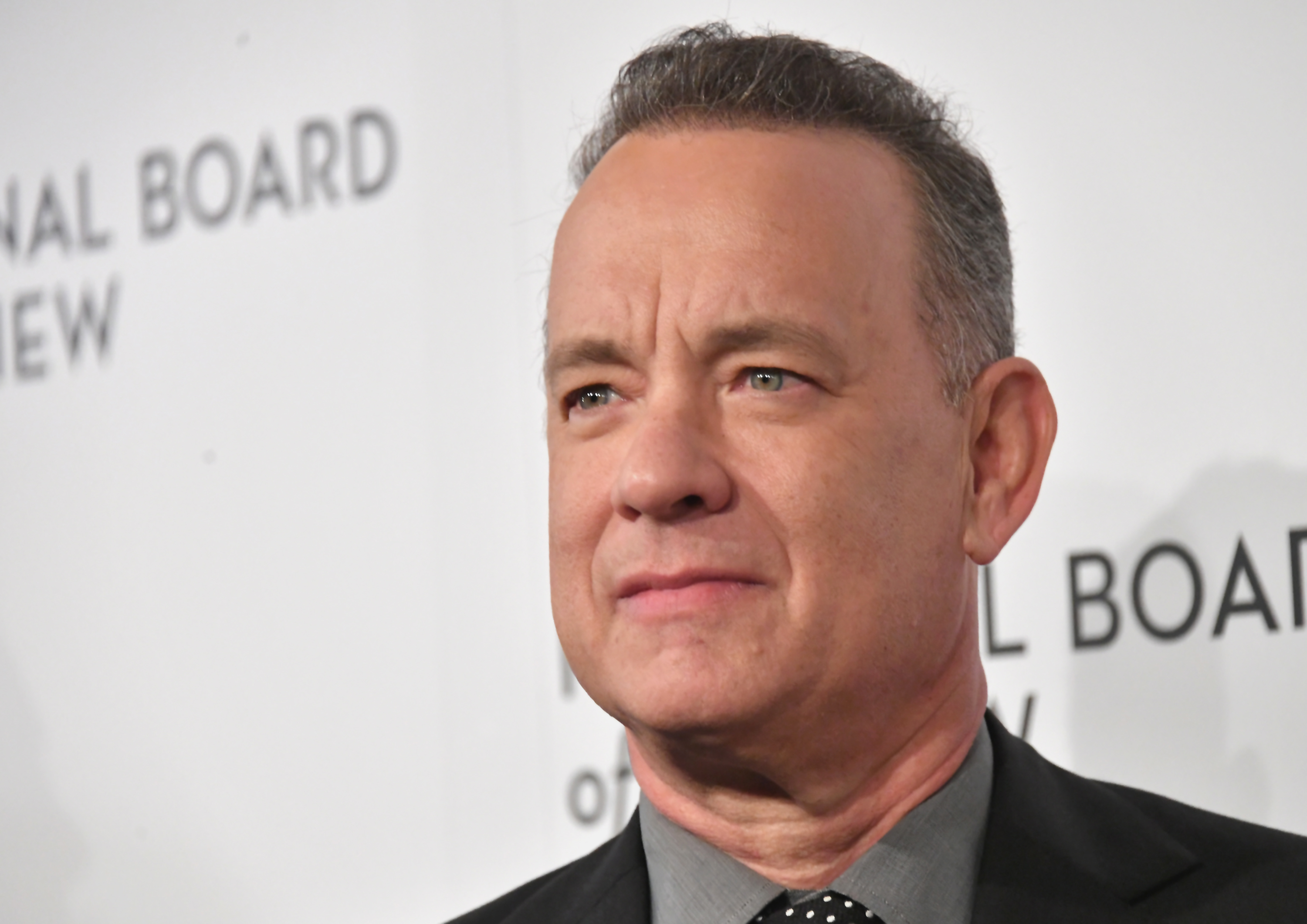 Tom Hanks posing for cameras at annual awards gala