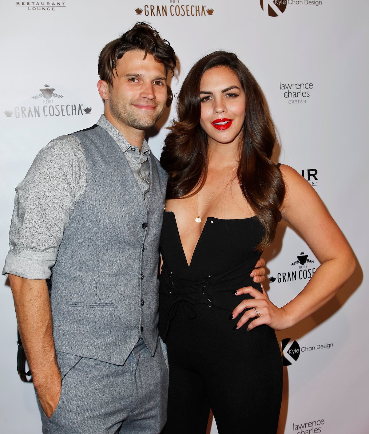 Tom schwartz and Katie Maloney pose together for the camera.