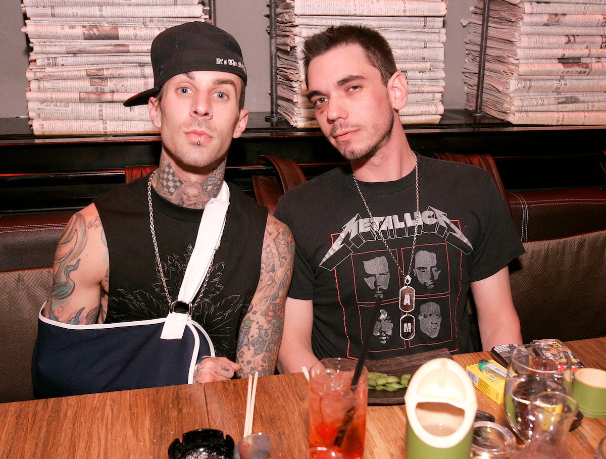 Travis Barker wears a cast on his arm while friend DJ AM sports a black eye at dinner together.