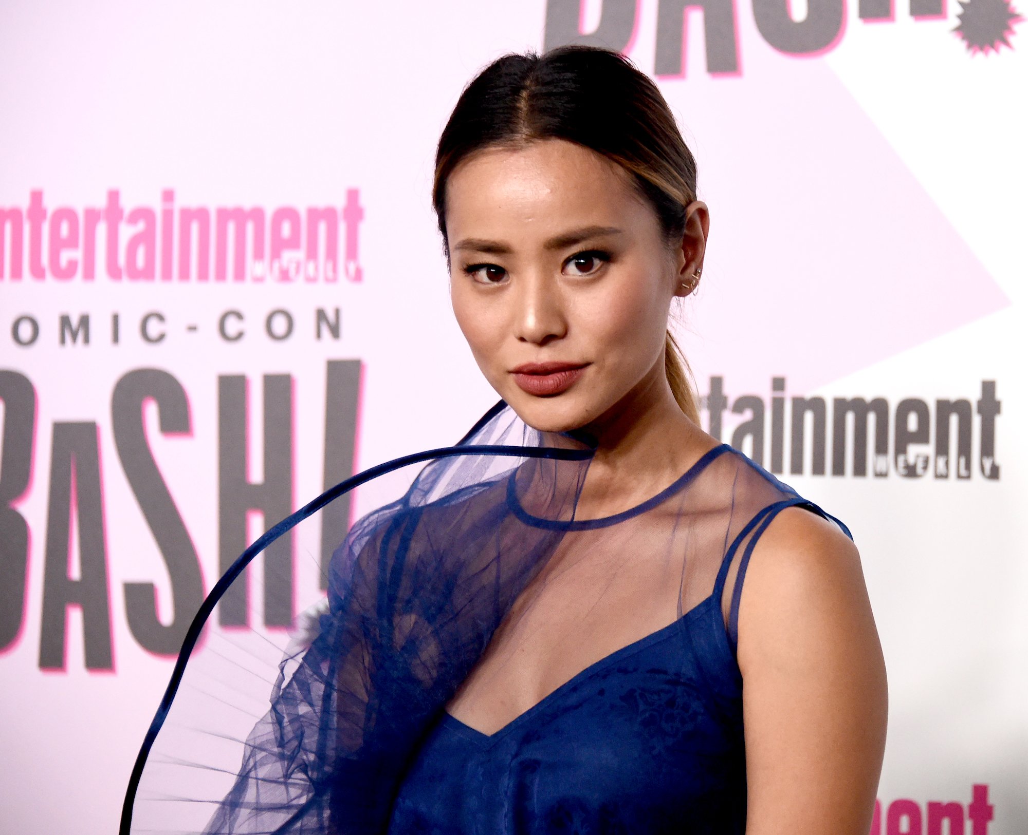 True crime podcaster actor Jamie Chung on the EW Comic-Con red carpet