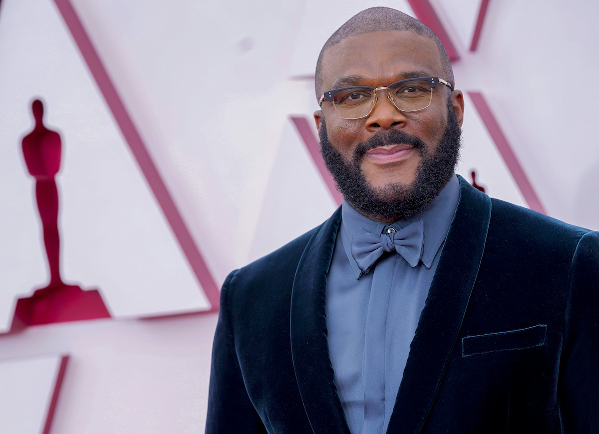 Tyler Perry wears a dark suit at an award show