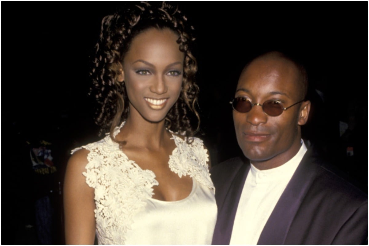Tyra Banks and John Singleton embracing each other at a premiere in the 1990s.