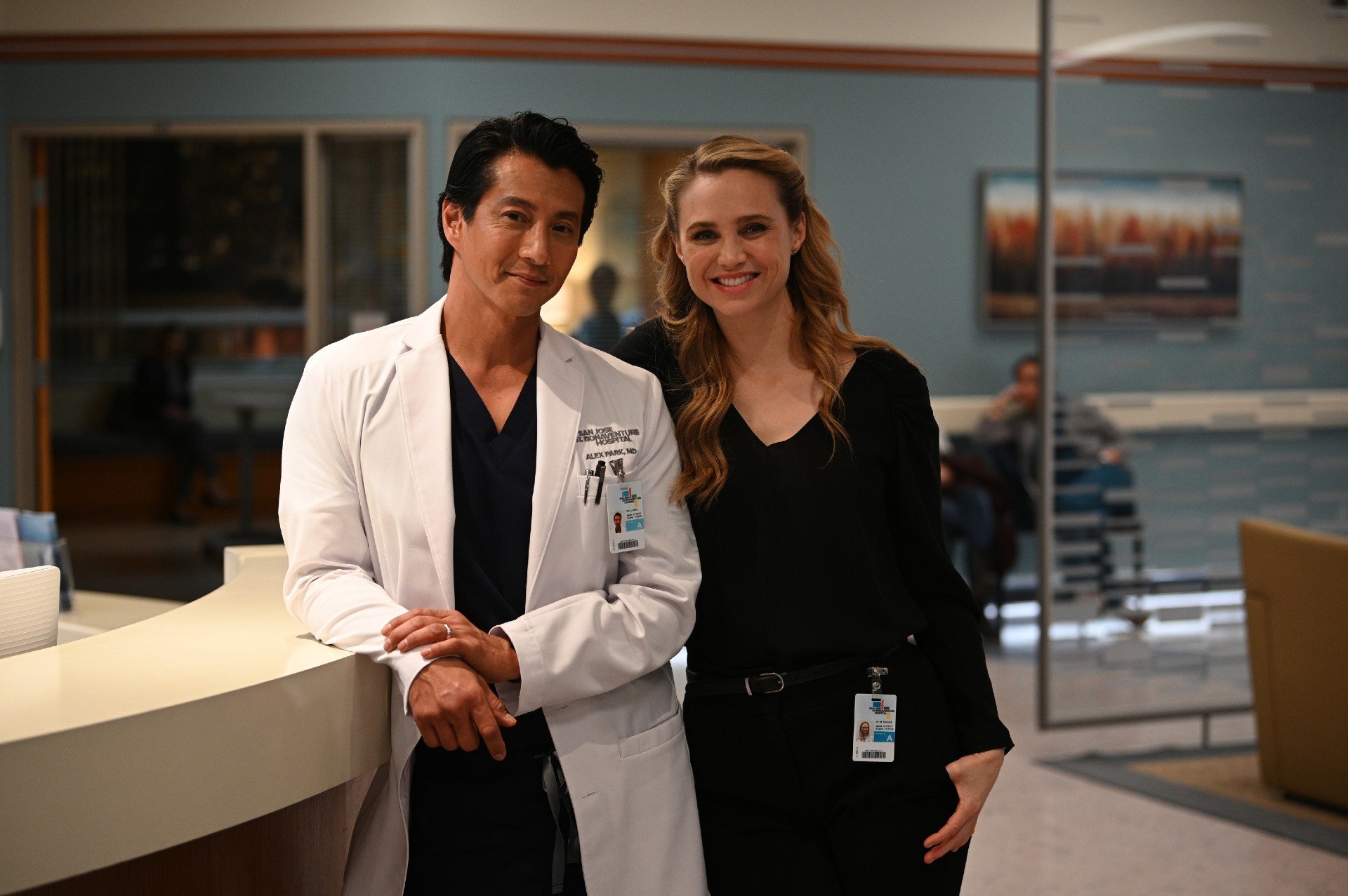 Will Yun Lee and Fiona Gubelmann stand at the nurse's station on the set of 'The Good Doctor'