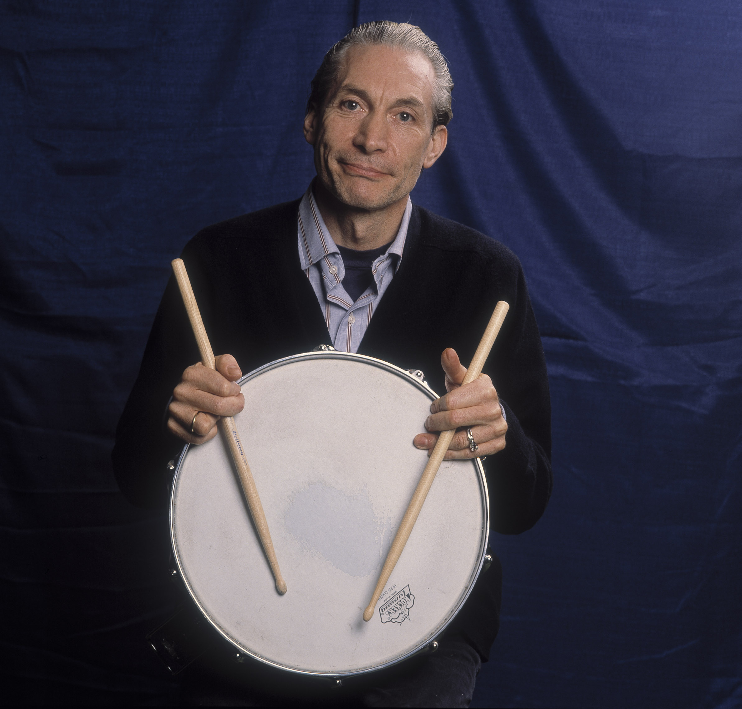 The Rolling Stones' Charlie Watts with a drum