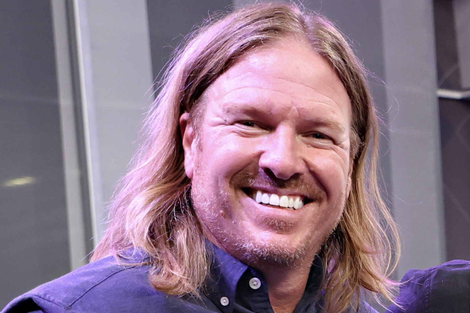 Chip Gaines sporting his long locks and smiling