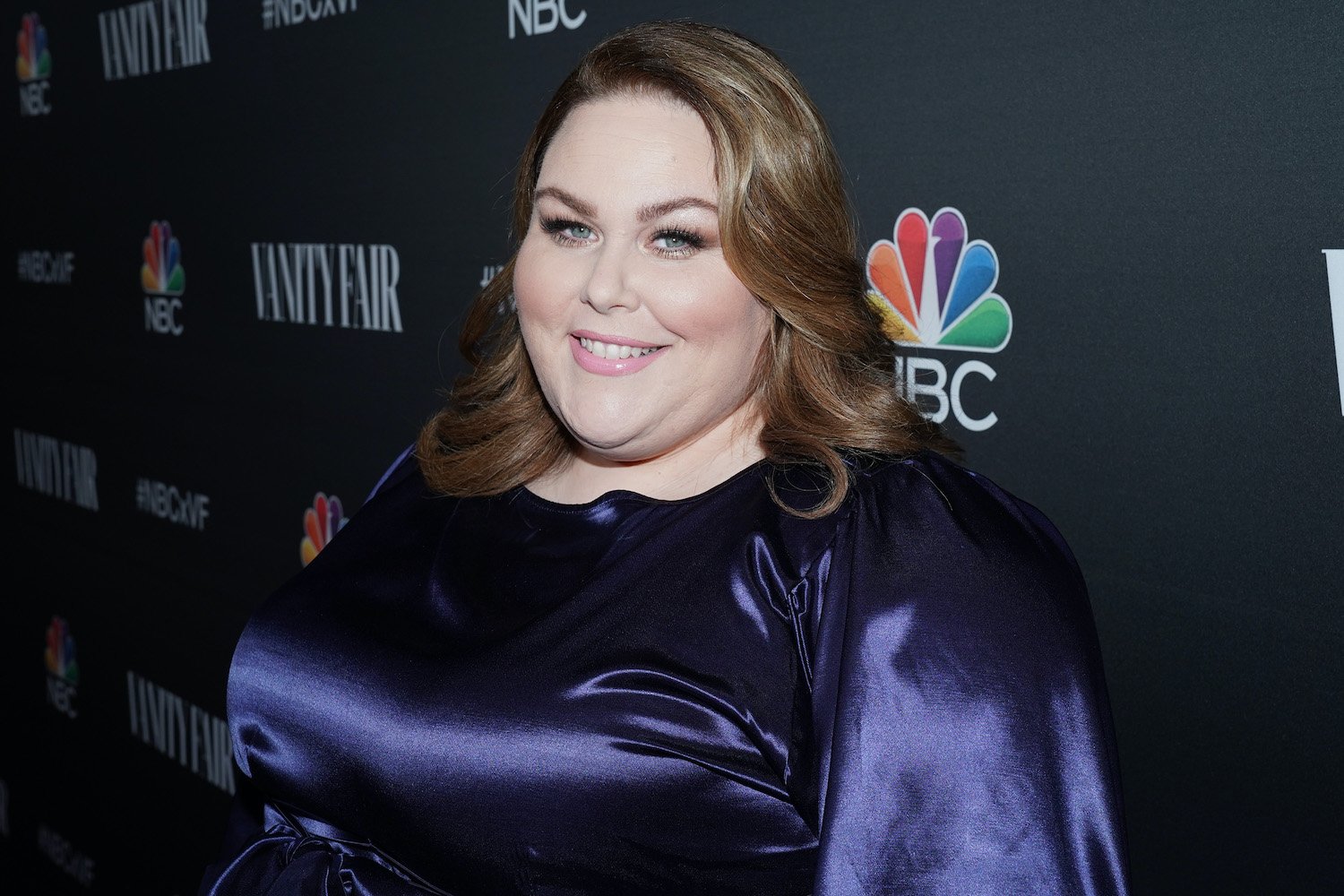 Chrissy Metz smiles as she poses on the red carpet of the NBCUniversal NBC and Vanilty Fair Primetime Party