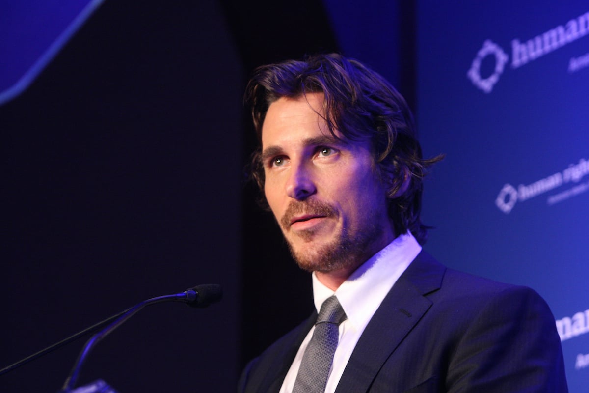 Christian Bale speaks at a podium | Bennett Raglin/WireImage