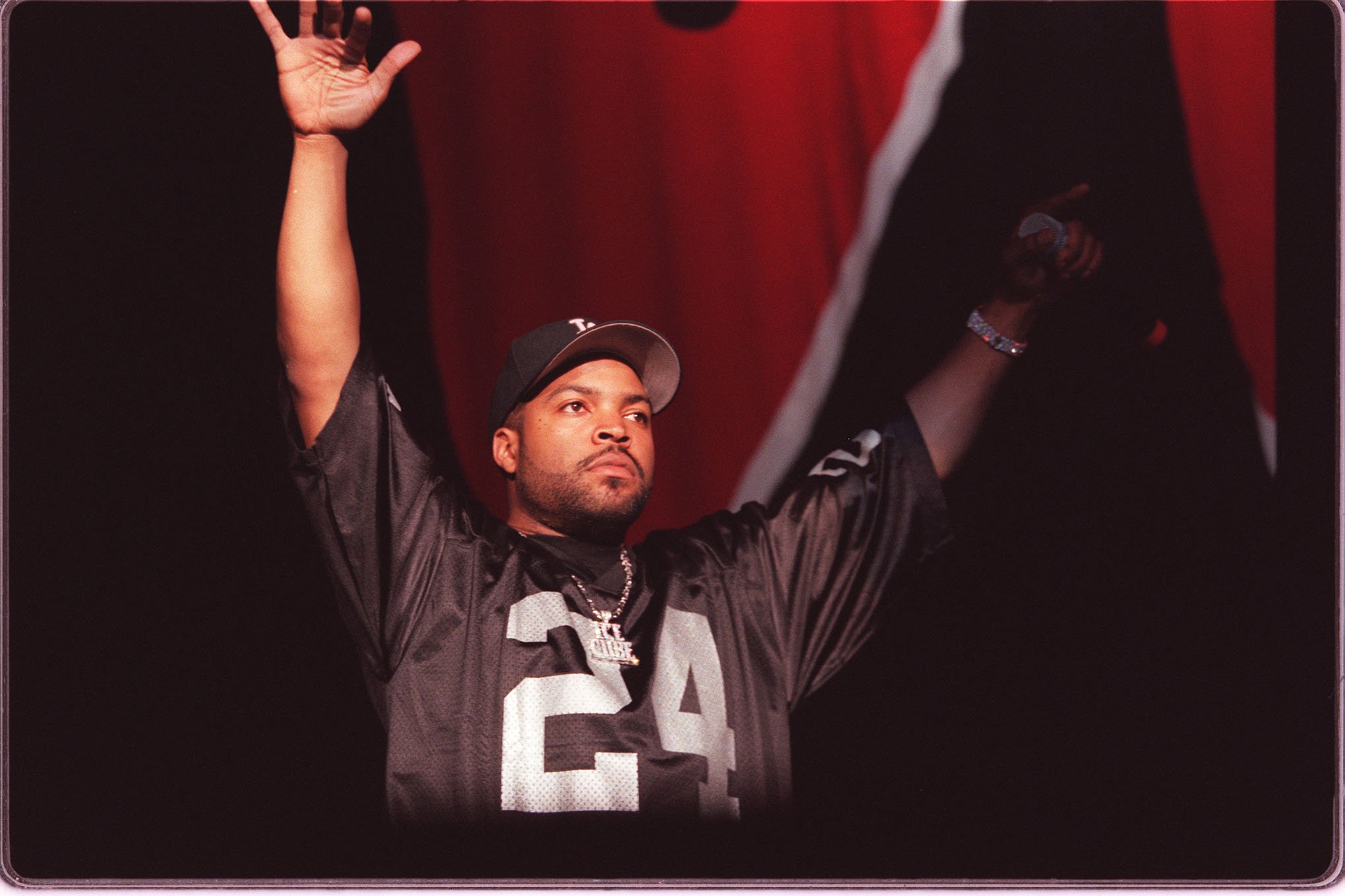 Ice Cube with his hands raised