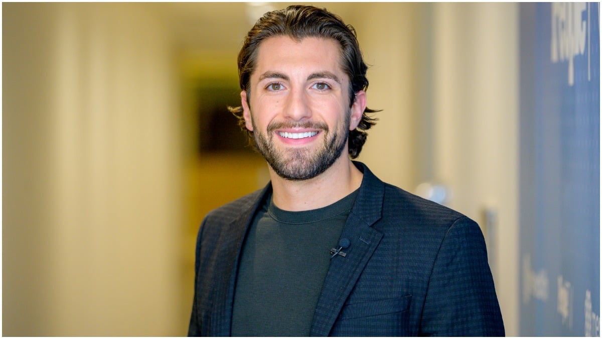 jason tartick poses for a photograph