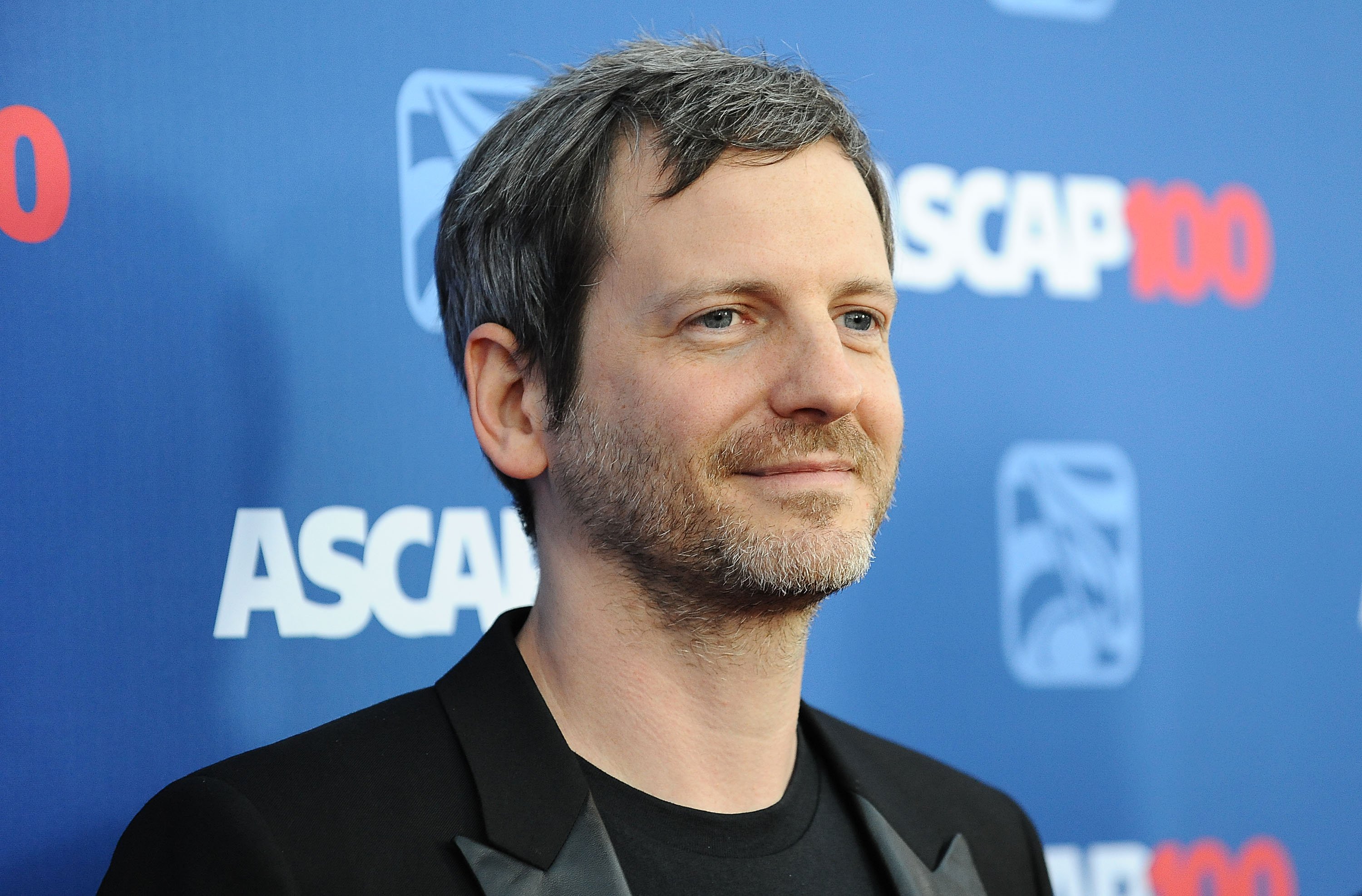 Dr. Luke with a blue background