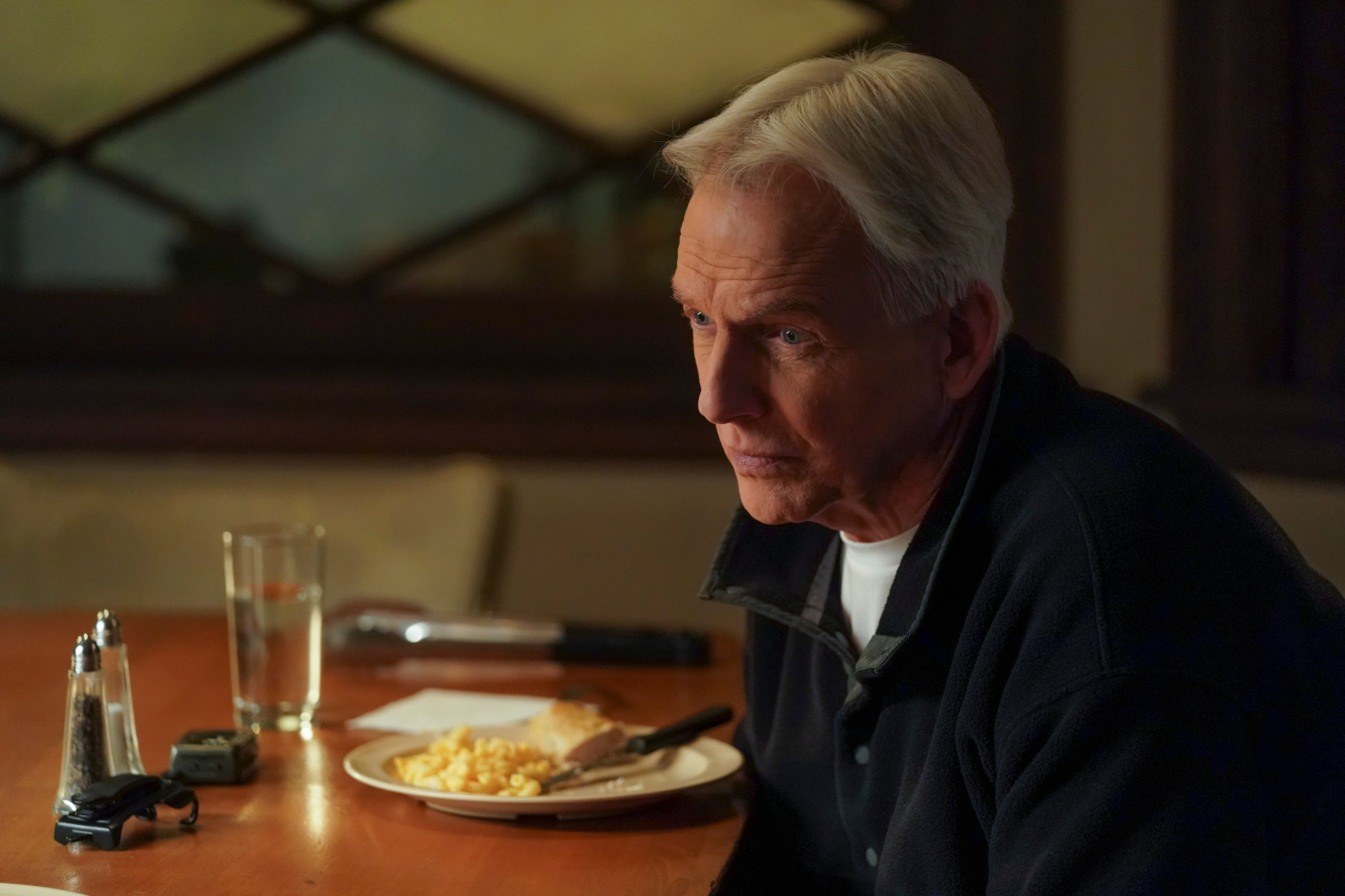 Mark Harmon as Gibbs, sitting at the dinner table during a scene from 'NCIS'