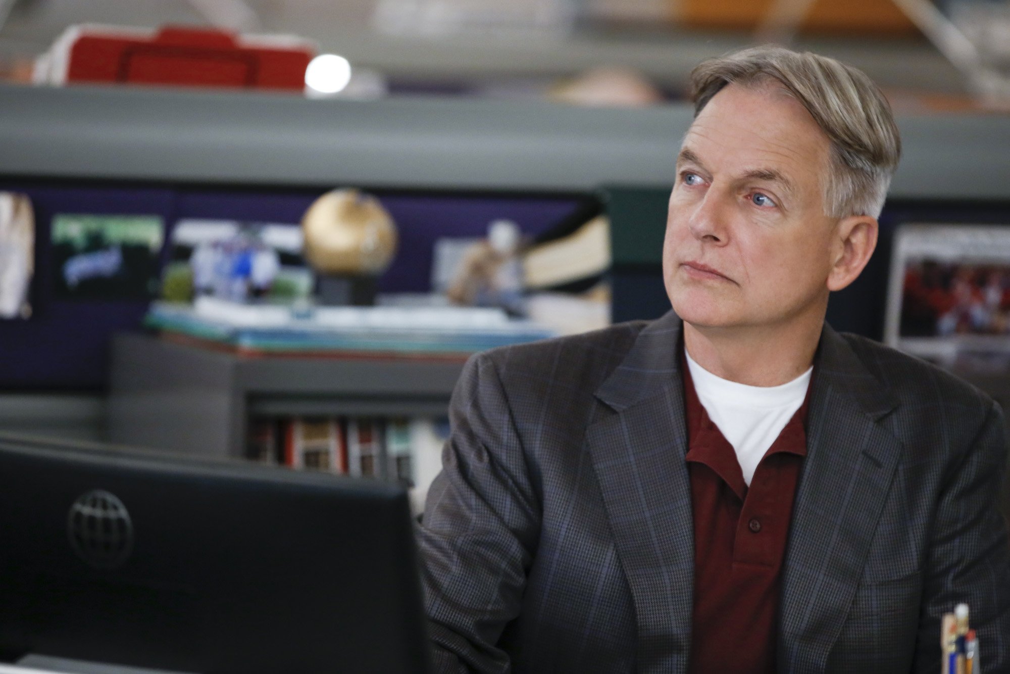 Mark Harmon sits at his desk on 'NCIS'  