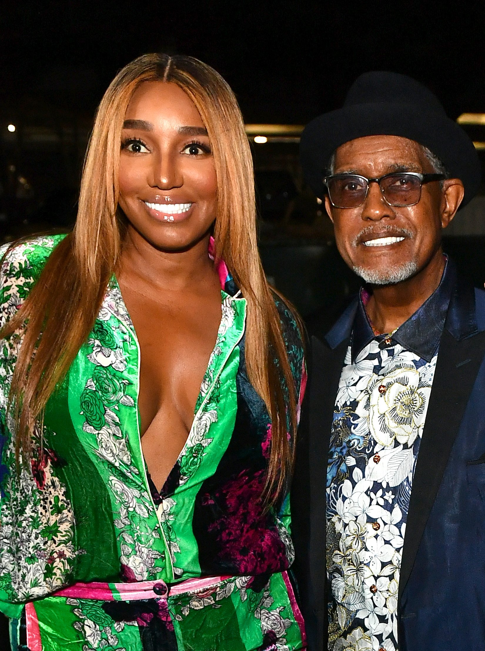 Nene Leakes and her husband Gregg smiling during the opening of The Linnethia Lounge