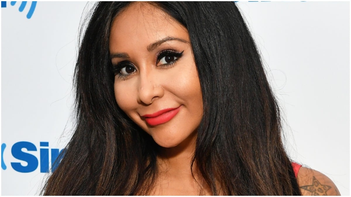 Nicole Polizzi poses on the red carpet for a photo.