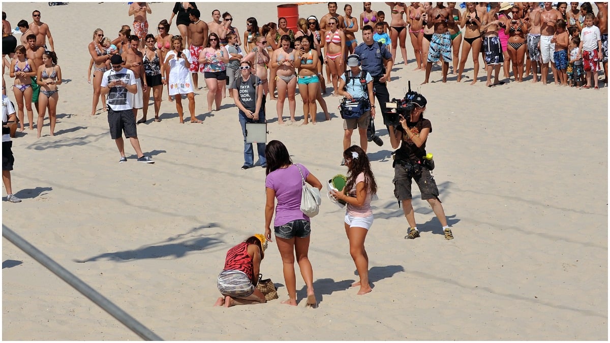 Nicole Polizzi is drunk on the beach in a Jersey Shore episode.