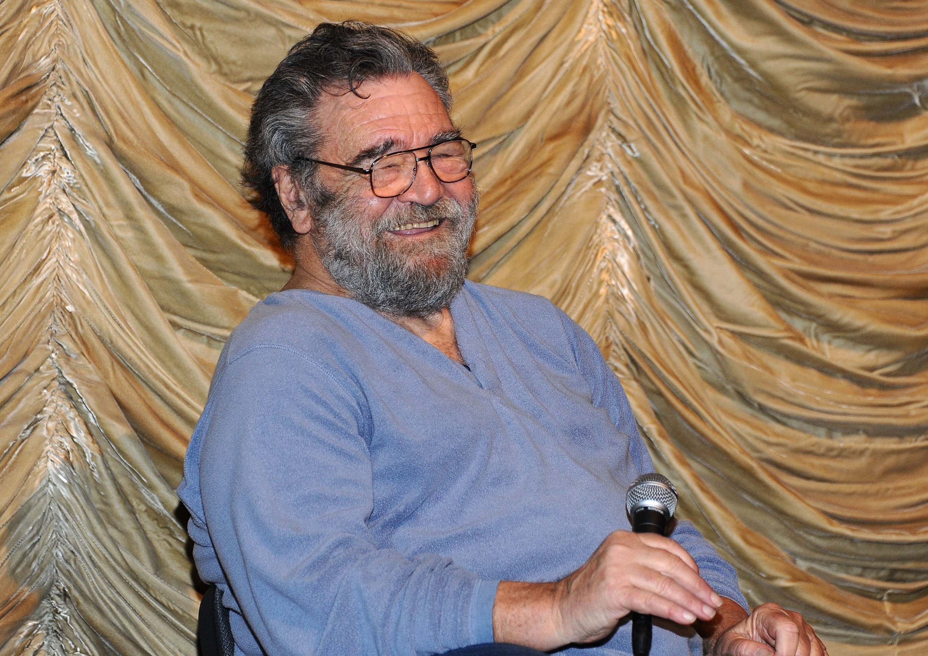 Ralph Bakshi, director of 'The Lord of the Rings,' in front of a curtain