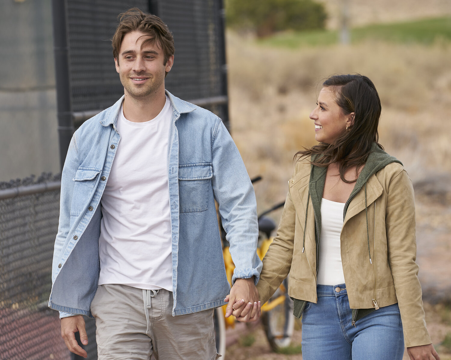 Greg Grippo and Katie Thurston walk holding hands during a date on 'The Bachelorette.'