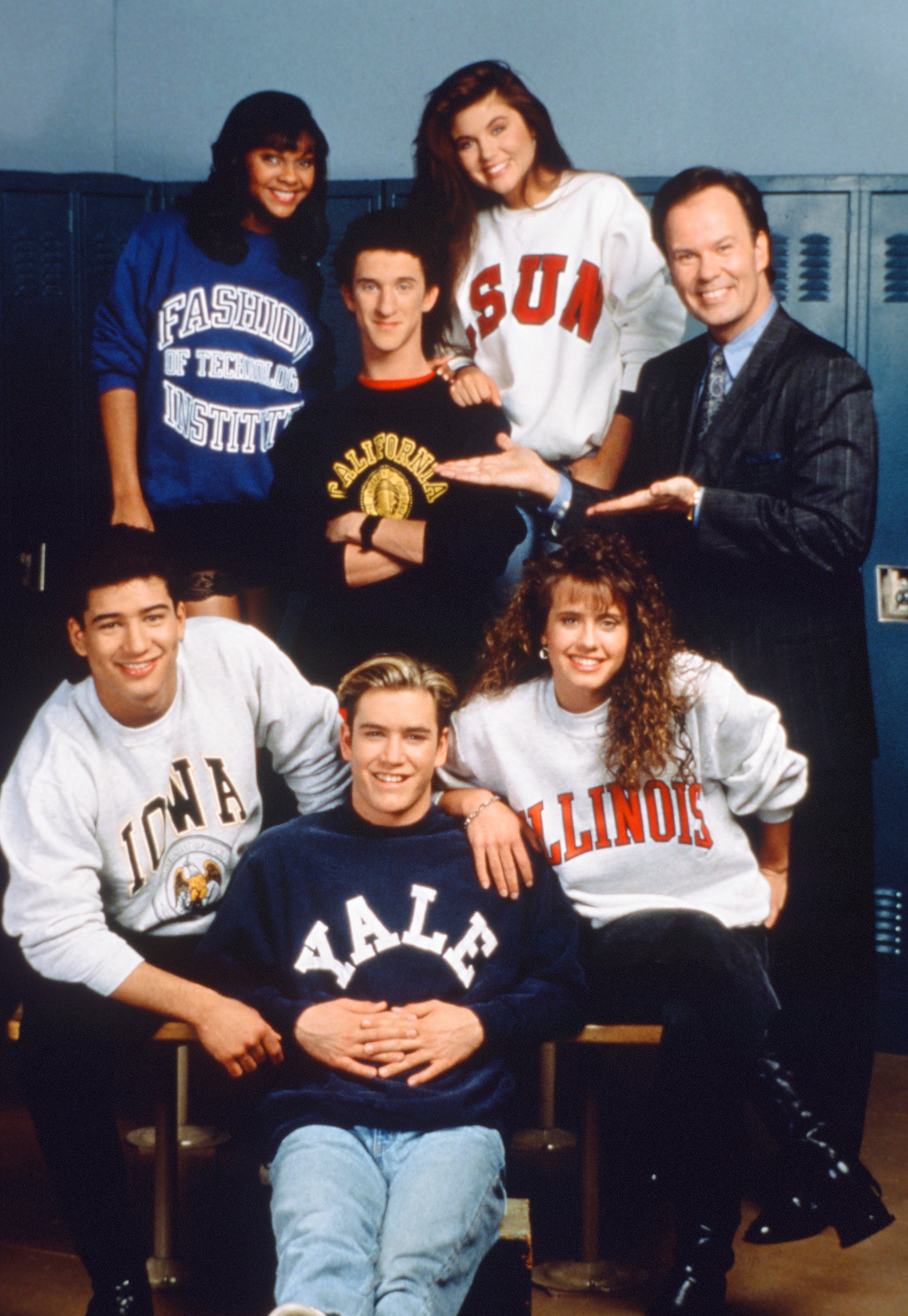 The cast of 'Saved by the Bell' season 4 are seen wearing college sweatshirts with Mr. Belding
