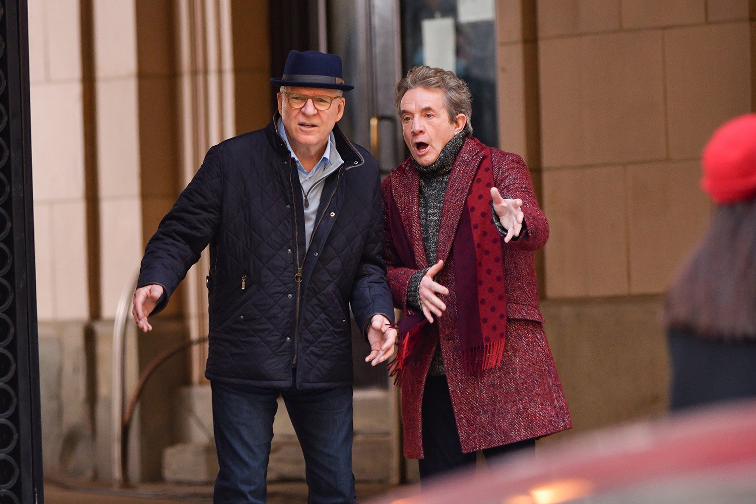 Steve Martin and Martin Short stand outside a building in New York