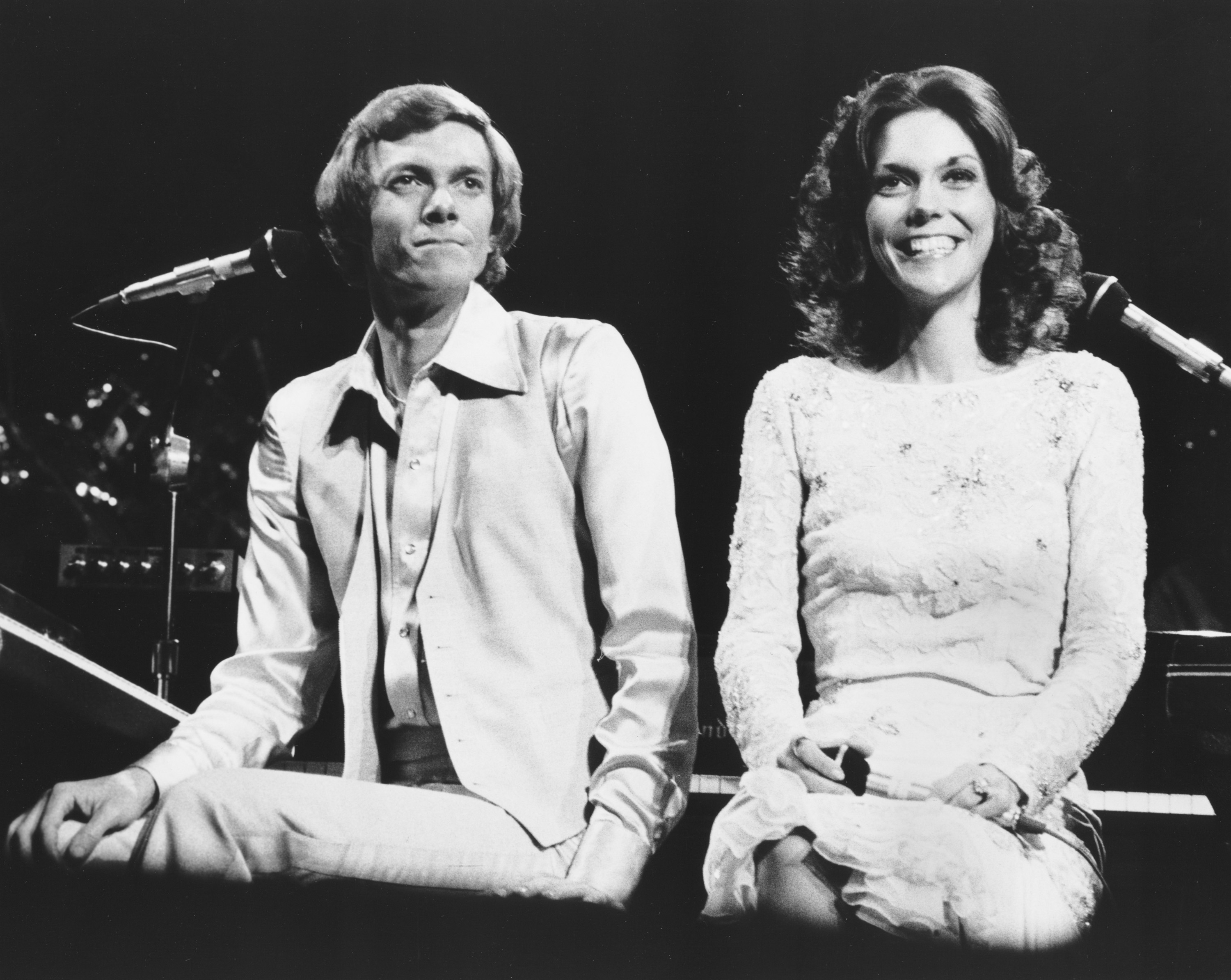 The Carpenters' Richard Carpenter and Karen Carpenter with microphones