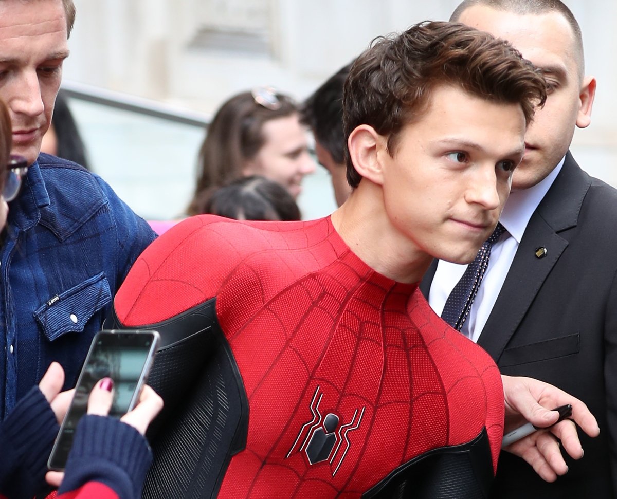 Tom Holland dressed as Spider-Man to meet fans