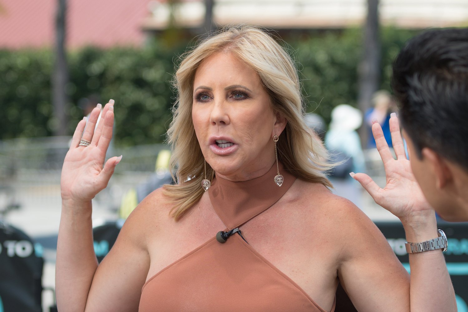 Vicki Gunvalson looking surprised during an interview on the 'Extra' set
