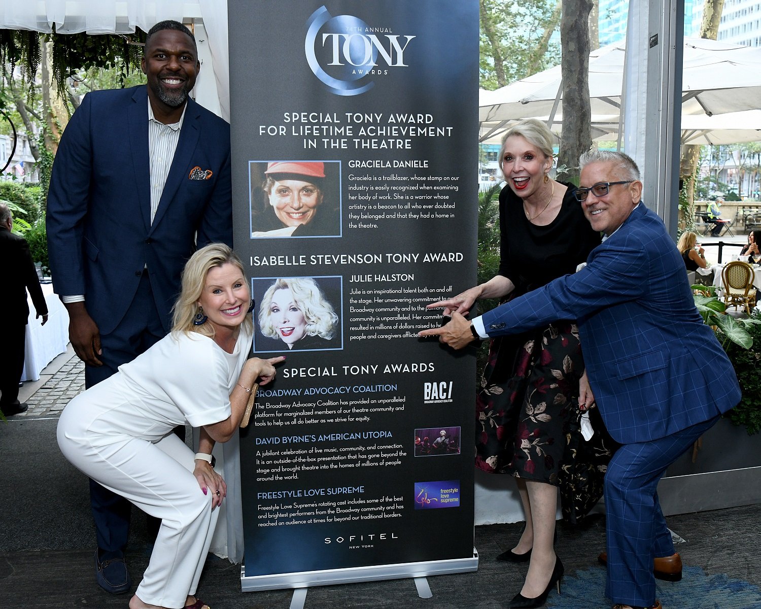 Julie Halston and her party stand next to an announcement at the 2002 Tony Awards. Halton recieved the Issabelle Stevenson Award