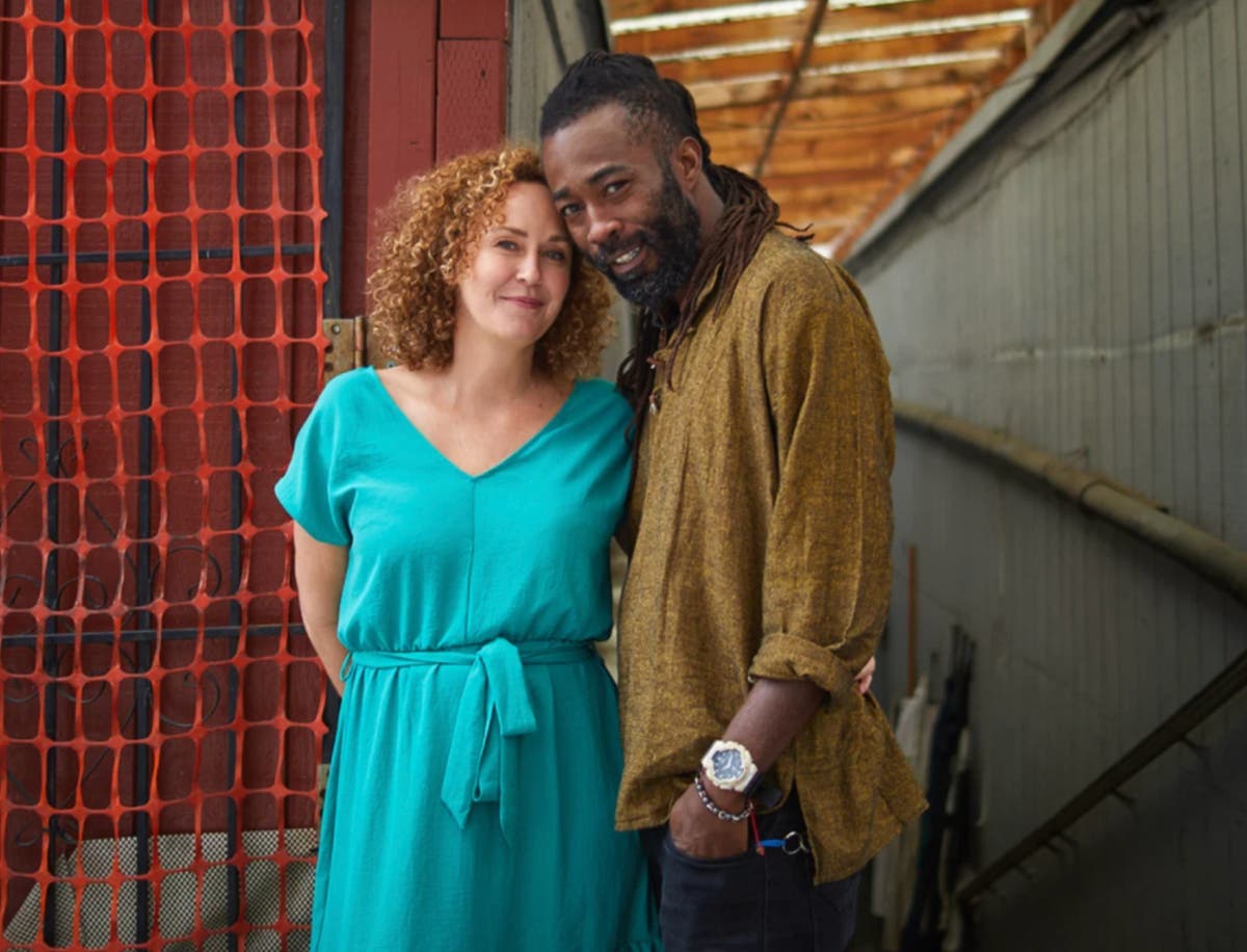 90 Day Fiancé Stars Ellie and Victor. Ellie is pictured here in a blue dress, while Victor is pictured here in a yellow long-sleeved shirt