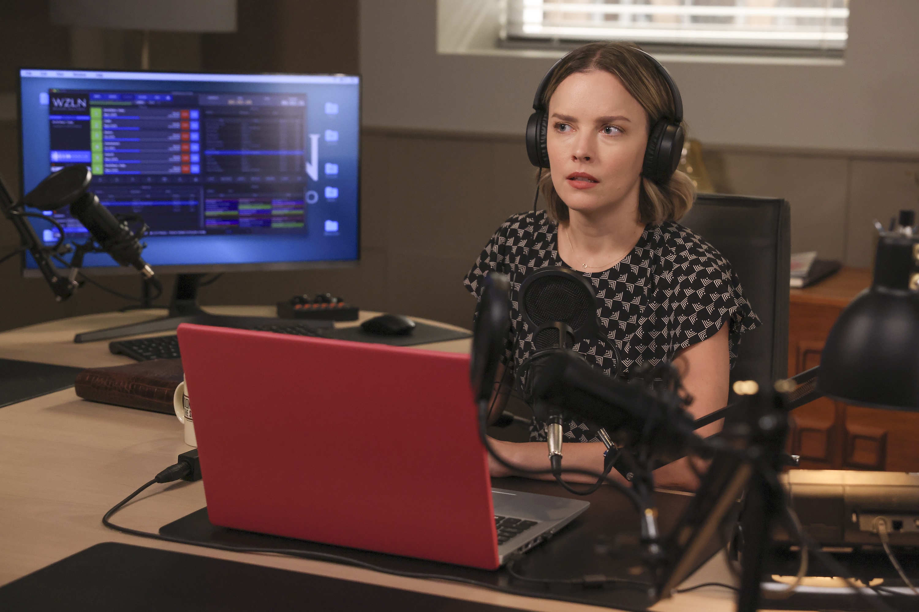A Million Little Things Season 4 spoilers Episode 2 Maggie sits with headphones looking worried
