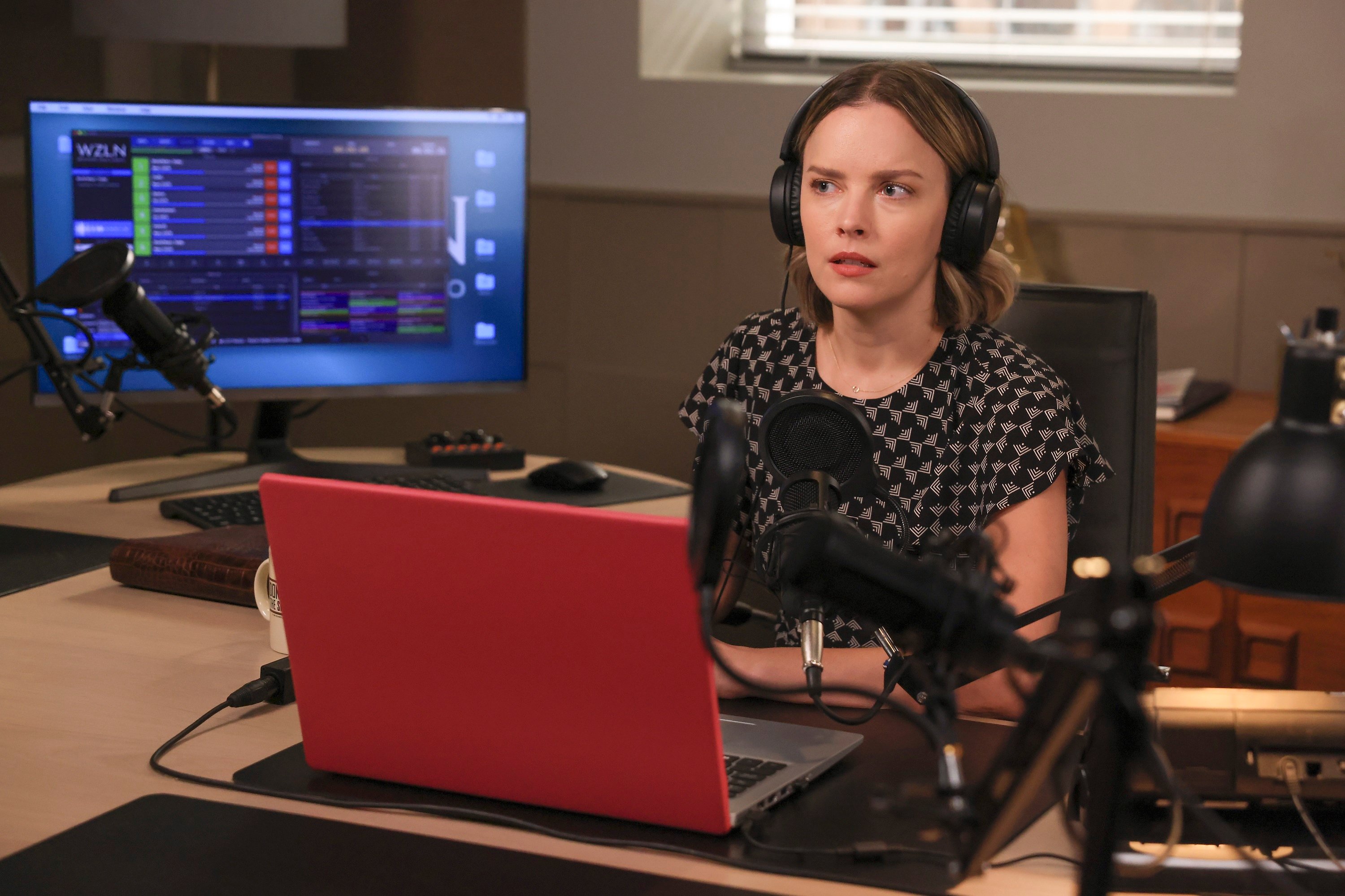 A Million Little Things Season 4 spoilers Episode 2 Maggie sits with headphones looking worried