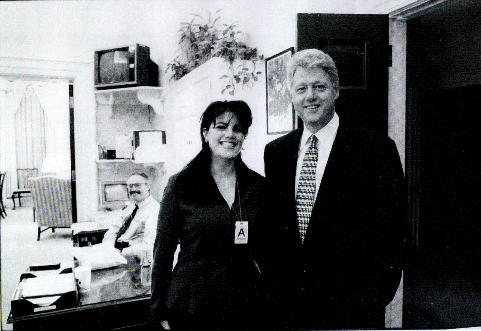 Black-and-white photo of Monica Lewinsky when she was an intern meeting President Bill Clinton at a White House function