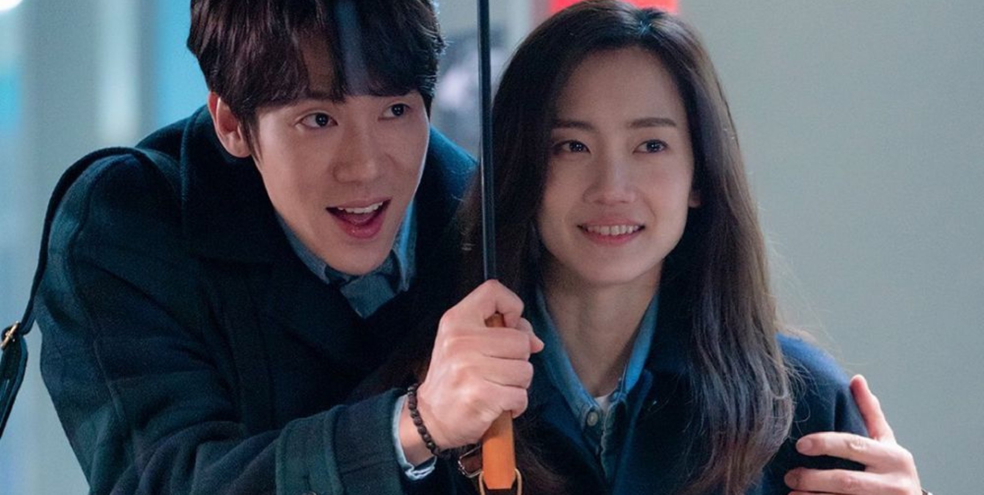 Actors Yoo Yeon-Seok and Shin Hyun-Been in 'Hospital Playlist 2' K-drama holding umbrella in the rain