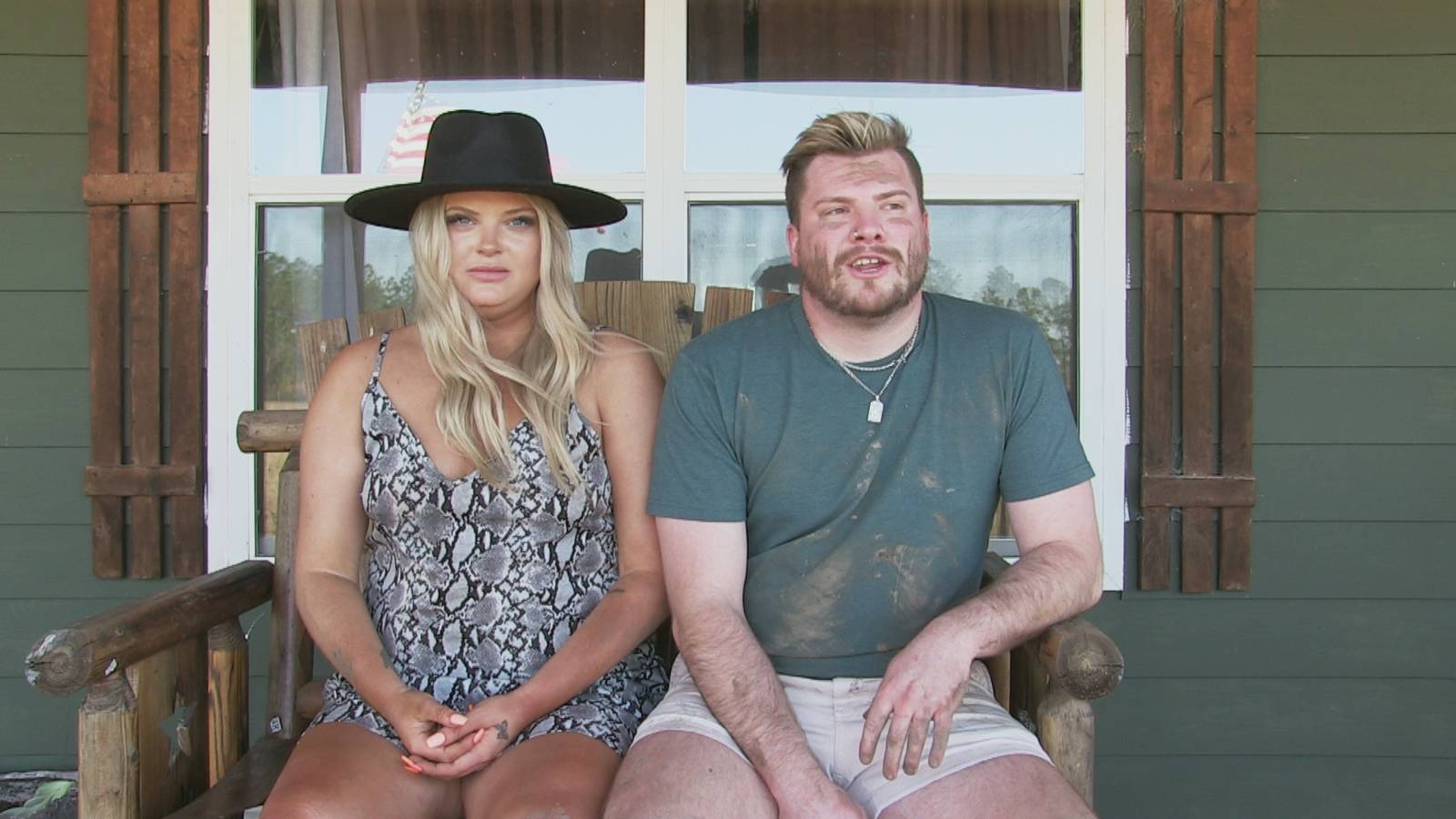 'Floribama Shore' stars Aimee Hall and Codi Butts, covered in mud, sitting on her porch looking into the camera